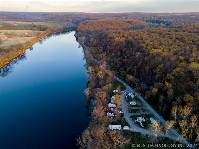 aerial view at dusk with a water view