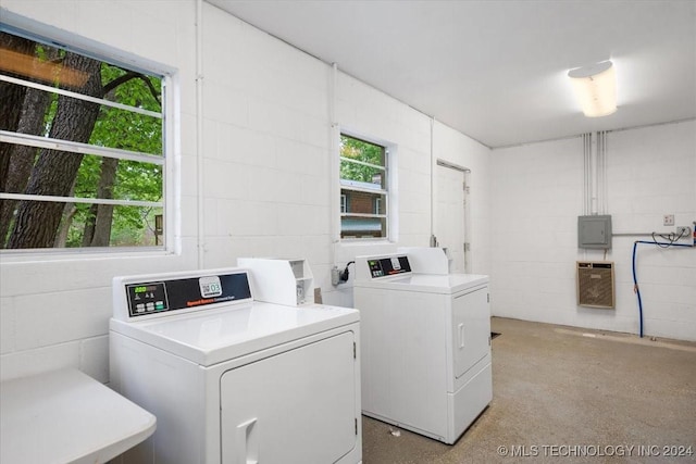 9596 N 447th Rd, Spavinaw, OK 74366 - shared laundry featuring washing machine and clothes dryer, heating unit, concrete block wall, and electric panel