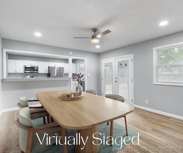 dining area with light wood finished floors, recessed lighting, baseboards, and french doors