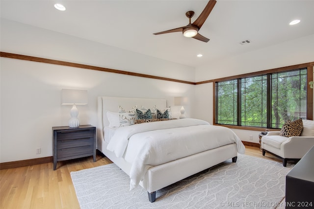 bedroom featuring wood-type flooring and ceiling fan