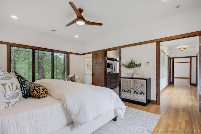 bedroom featuring light wood-type flooring and ceiling fan