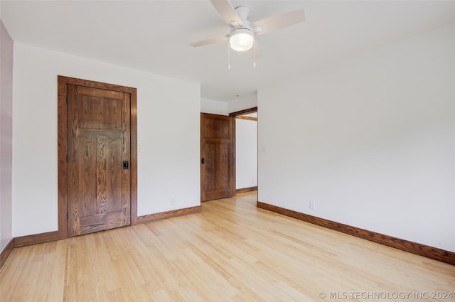 unfurnished bedroom with light wood-type flooring and ceiling fan