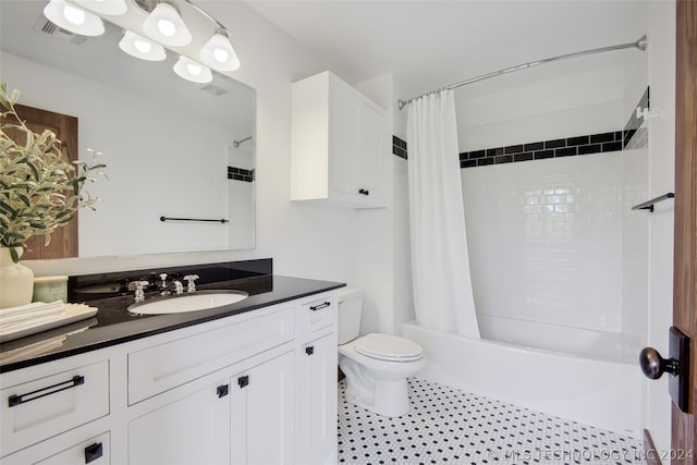 full bathroom featuring toilet, shower / bath combo, and vanity