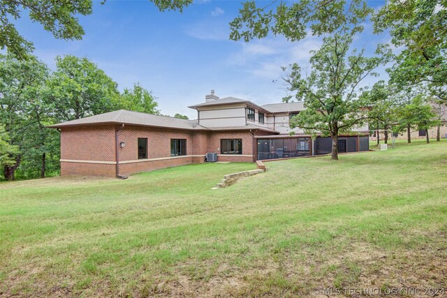 rear view of house with a lawn