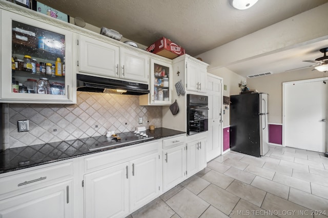 kitchen featuring tasteful backsplash, white cabinets, black appliances, light tile patterned floors, and ceiling fan