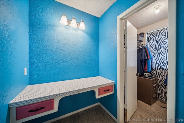 bathroom featuring a textured ceiling