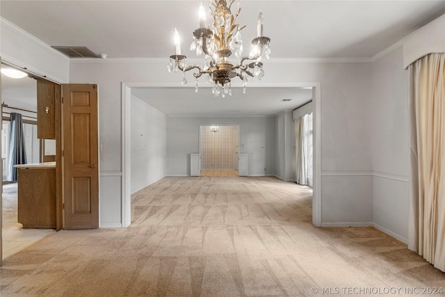 unfurnished dining area with light carpet, an inviting chandelier, and crown molding