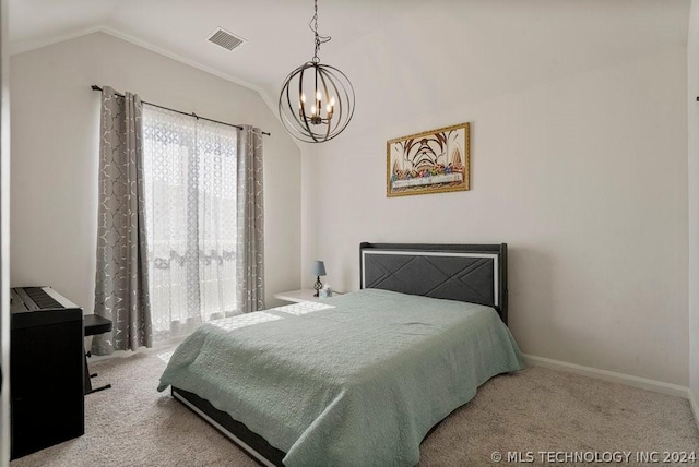 bedroom with vaulted ceiling, carpet floors, and a chandelier