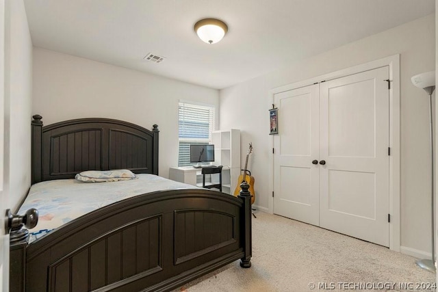 carpeted bedroom with a closet