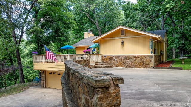 view of patio / terrace featuring a garage