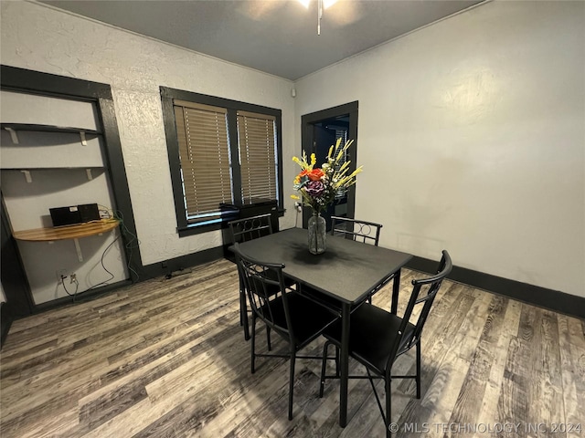 dining room with wood-type flooring