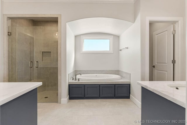 bathroom with vanity, tile patterned flooring, and independent shower and bath