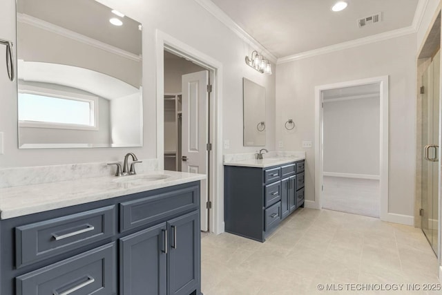 bathroom featuring vanity, tile patterned floors, a shower with door, and ornamental molding