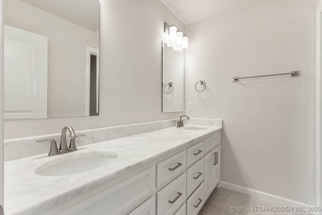 bathroom with tile patterned flooring and vanity