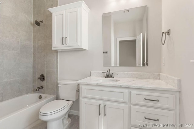 full bathroom with vanity, toilet, and tiled shower / bath combo