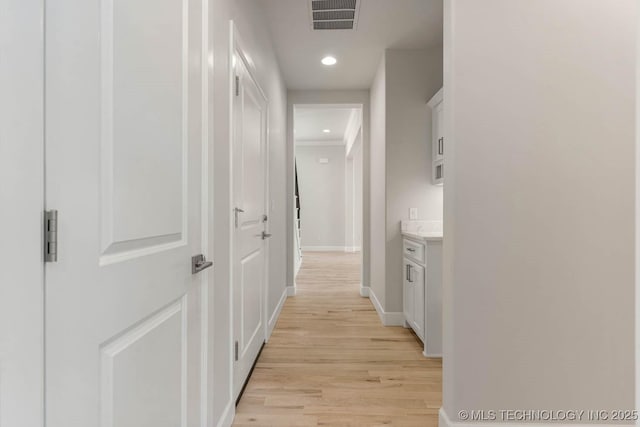 hallway featuring light wood-type flooring