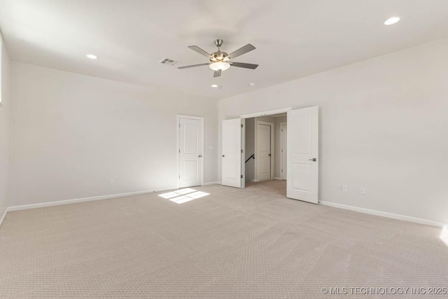 unfurnished bedroom with ceiling fan and light carpet