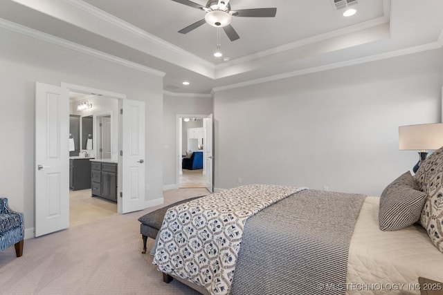 bedroom featuring crown molding, baseboards, light carpet, and a raised ceiling