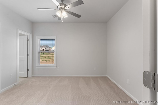 unfurnished room with light colored carpet, baseboards, ceiling fan, and visible vents