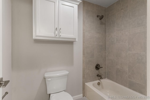 full bath with baseboards, toilet, and shower / washtub combination