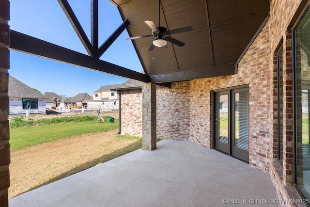 view of patio / terrace with a residential view and a ceiling fan
