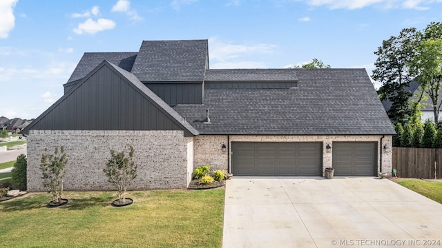 view of front property with a front lawn and a garage