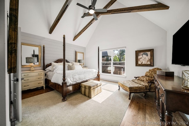 bedroom with beamed ceiling, high vaulted ceiling, hardwood / wood-style flooring, and ceiling fan