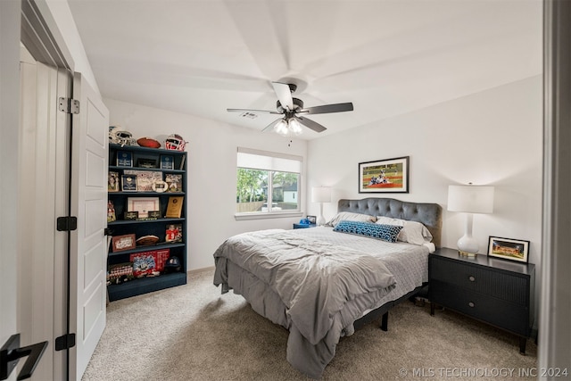 carpeted bedroom with ceiling fan