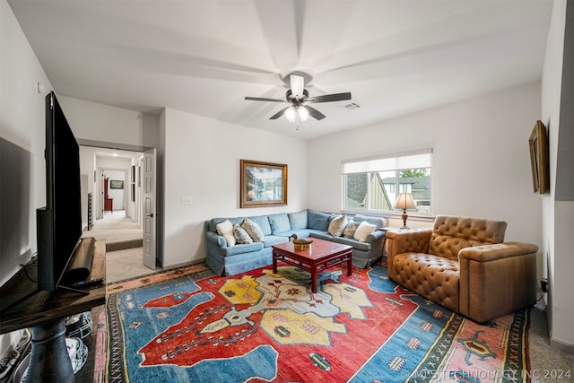 living room with ceiling fan and carpet floors