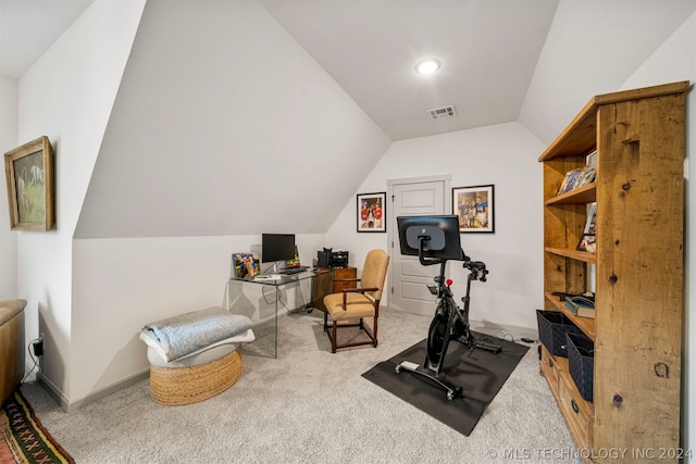 exercise room with carpet and vaulted ceiling