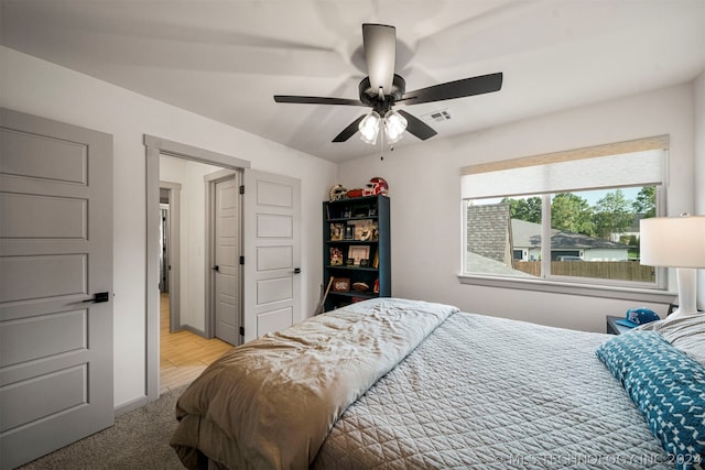 carpeted bedroom with ceiling fan