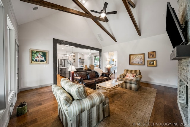 living room featuring beamed ceiling, high vaulted ceiling, wood-type flooring, and a brick fireplace