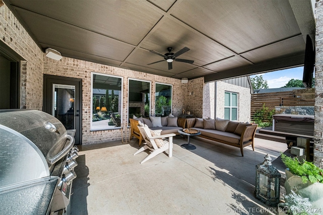 view of patio / terrace featuring a grill, an outdoor living space, and ceiling fan