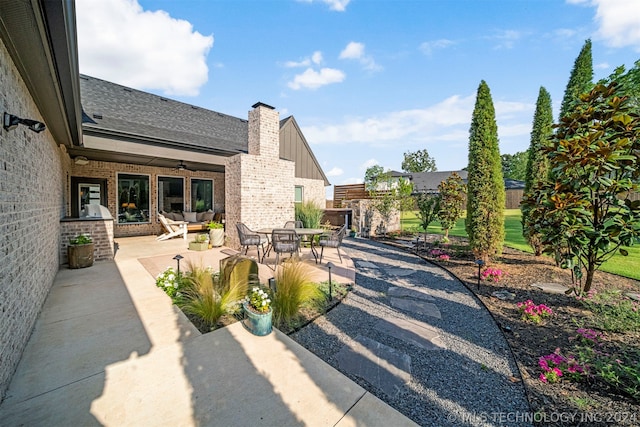 view of patio featuring ceiling fan