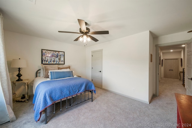 bedroom featuring ceiling fan and light colored carpet