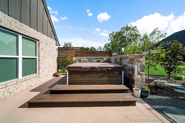 view of patio / terrace featuring a hot tub