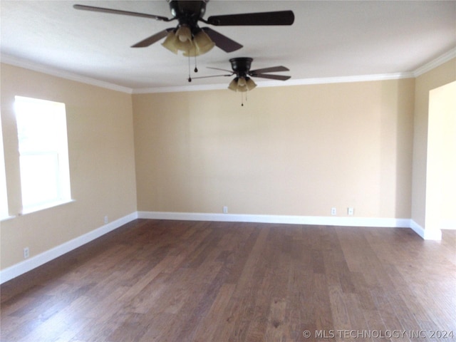 spare room with dark hardwood / wood-style floors, ceiling fan, and ornamental molding