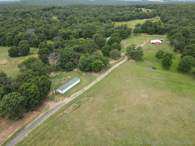 birds eye view of property with a rural view