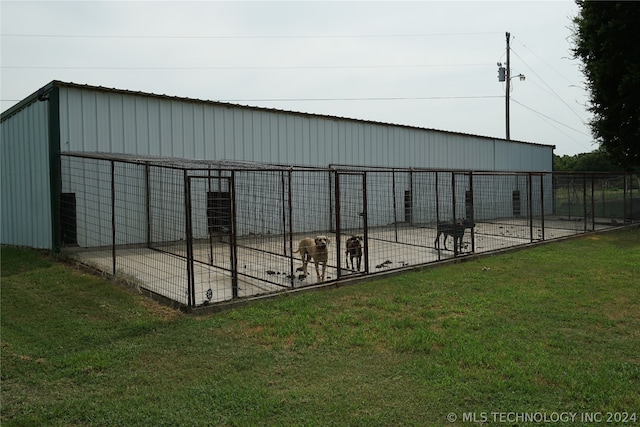 view of outdoor structure with a lawn