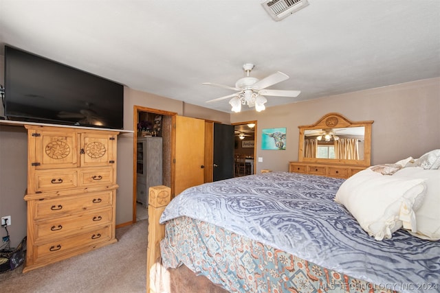 bedroom with ceiling fan and light colored carpet