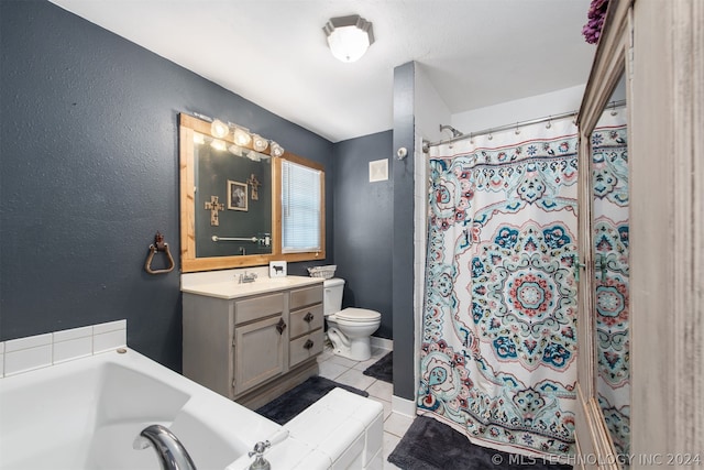 bathroom featuring toilet, vanity, and tile patterned floors