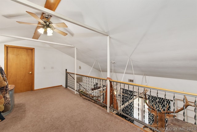 hallway with vaulted ceiling and carpet floors