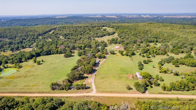 drone / aerial view with a water view and a rural view