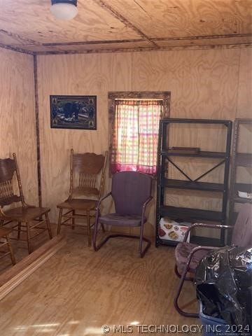 sitting room featuring hardwood / wood-style flooring and wood ceiling