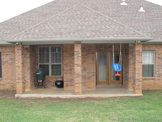 back of property featuring a patio