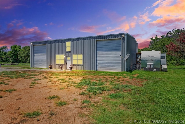 outdoor structure at dusk with a garage