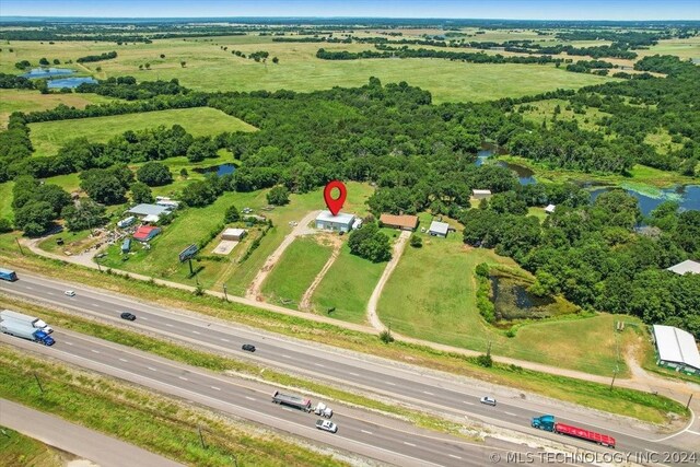 aerial view featuring a rural view and a water view