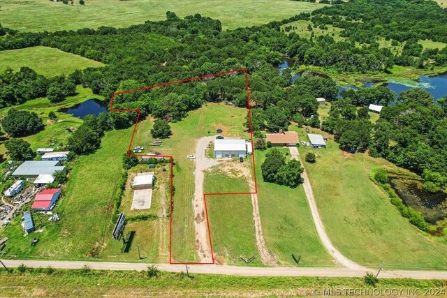 drone / aerial view featuring a water view and a rural view