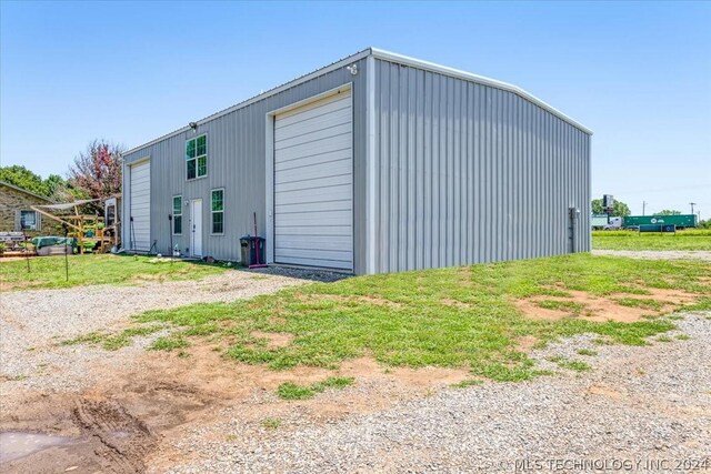 exterior space featuring an outbuilding