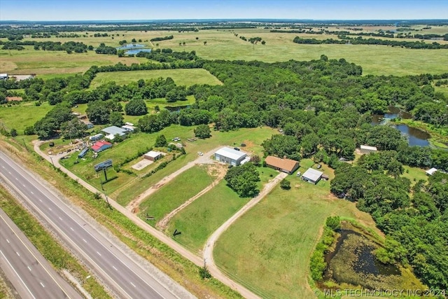 aerial view with a rural view and a water view